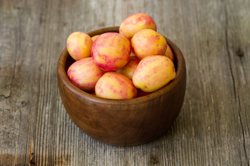 new red potatoes on wood
