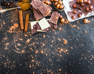 Chocolat and spices on black table