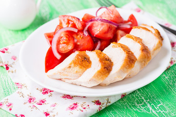 Grilled chicken breasts with fresh tomato salad