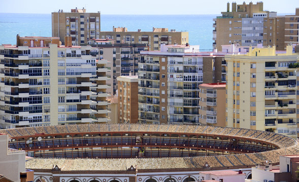 Malaga bullring with apartments and mediteranean sea