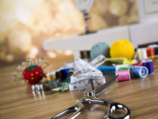 Sewing with color threads, meter and scissors