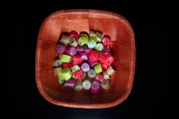 Colorful candies on black background