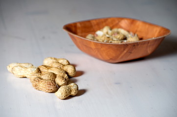 Peanuts in a brown bowl