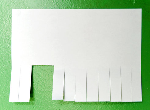 Tear off paper notice on the green wall