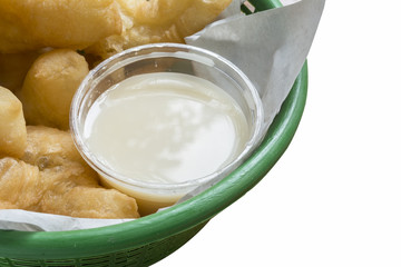 Breakfast in Thailand deep-fried doughstick and milk  on white b