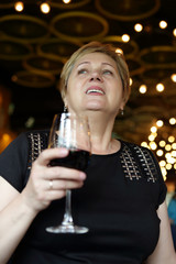 Woman with glass of red wine