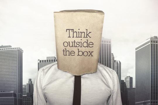 Businessman with a paper bag on head