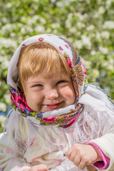 Little girl smiling in soft background