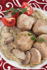 Bread dumplings in mushroom sauce