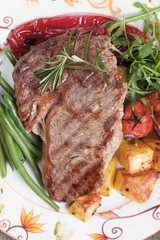 Beef steak with potato and vegetables