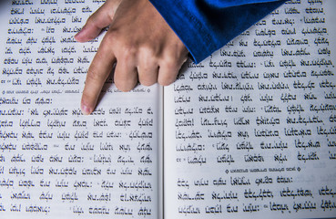a prayers hand on a jewish bible