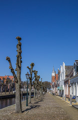Fototapeta na wymiar Trees along the central canal in historical Sloten