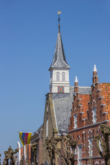 Church tower and facades in the historical center of Sloten