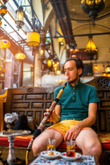 Man smoking turkish hookah