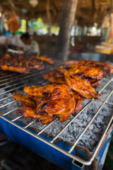 Roast chicken leg on grill