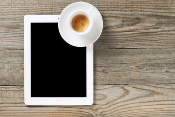 Obraz na płótnie Canvas tablet computer with black coffee
