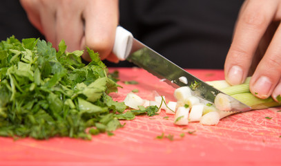 sliced green onions with a knife