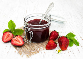 Strawberry jam and fresh strawberries