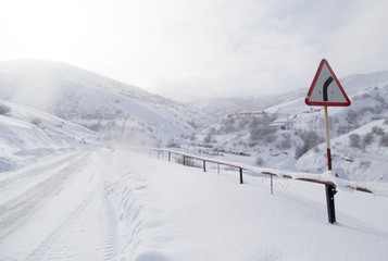 Naklejka na ściany i meble winter road in the mountains