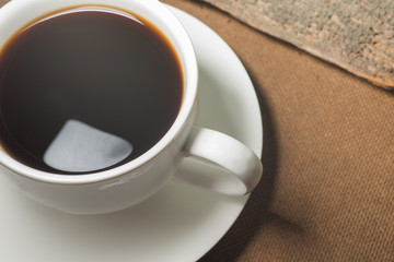 Coffee cup and Coffee powder on wood