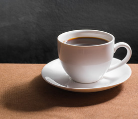 Coffee cup and Coffee powder on wood