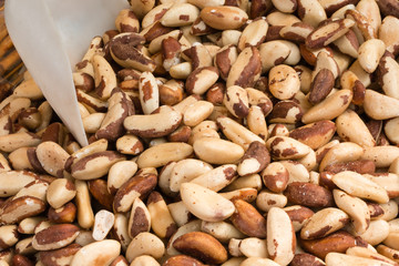 closeup of crunchy brazil nuts in wicker bowl