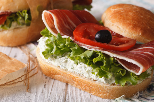 Sandwich with prosciutto closeup horizontal
