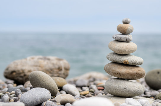 Round Smooth Stones Stacked on Rocky Beach