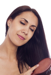 Fototapeta premium Woman with comb in her hands