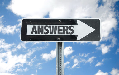 Answers direction sign with sky background