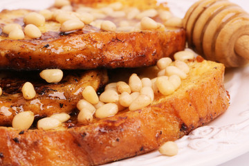 French toast with honey syrup croutons pine nuts breakfast sweet dessert selective soft focus