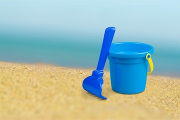 Bucket, spade, sand.