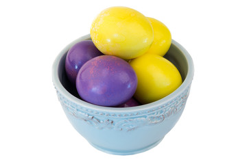 colored eggs in ceramic bowl Easter spring isolated on white background selective soft focus