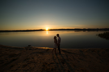 Couple in sunrise on the beach