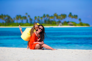 Fototapeta premium Little girl and young mother during beach vacation