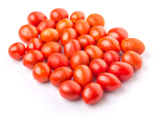 Bite sized red cherry grape tomato over white background
