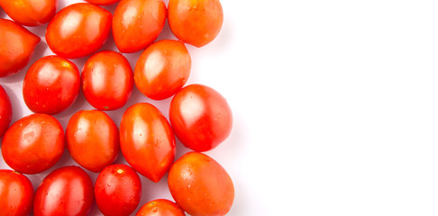 Bite sized red cherry grape tomato over white background