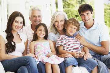 Extendend family sitting in garden