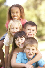 Group Of Children Piled Up In Park