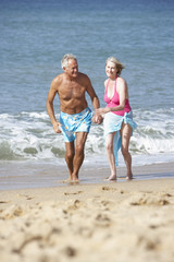 Senior Couple Enjoying Beach Holiday