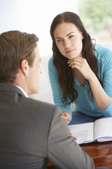 Woman Meeting With Financial Advisor At Home
