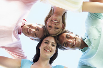 Group Of Friends Looking Down Into Camera