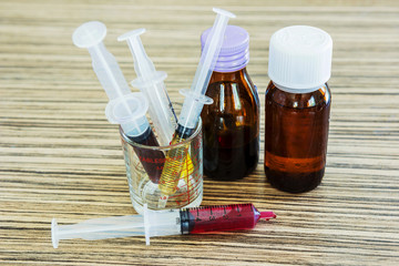 Syringe with syrup medicine use to feed for kids.