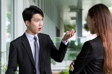Businessman argue with his assistant
