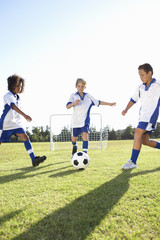 Obraz premium Group Of Boys Playing Football