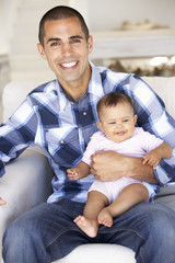 Obraz premium Young Father On Sofa At Home