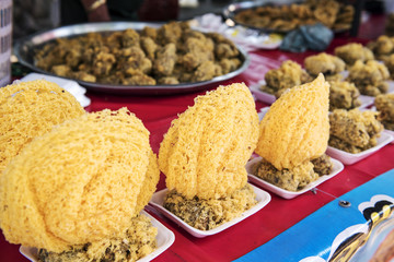 Thai dessert called “Khao Mao Tod” Deep-fried Bananas with Coconut