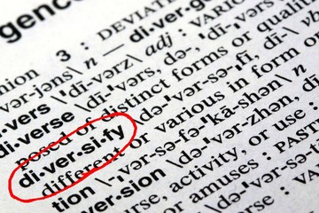 Closeup of the word diversify in the English dictionary