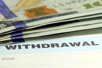 Withdrawal slip from bank checking or savings account - Finance and accounting concept