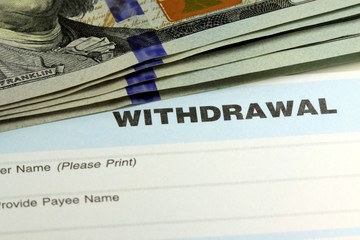 Withdrawal slip from bank checking or savings account - Finance and accounting concept